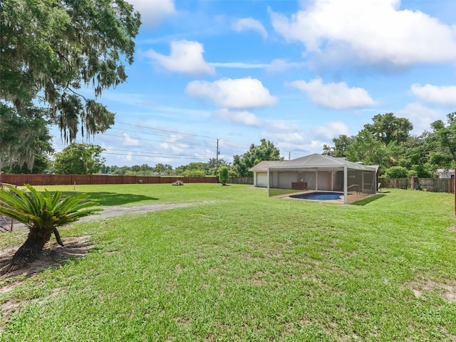 4660 SE 142nd Ln, Summerfield, FL 34491 - fenced backyard featuring a sunroom