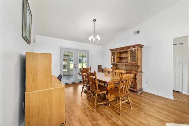 475 NE 155th Pl, Citra, FL 32113 - dining room with french doors, light wood-style flooring, a chandelier, and high vaulted ceiling