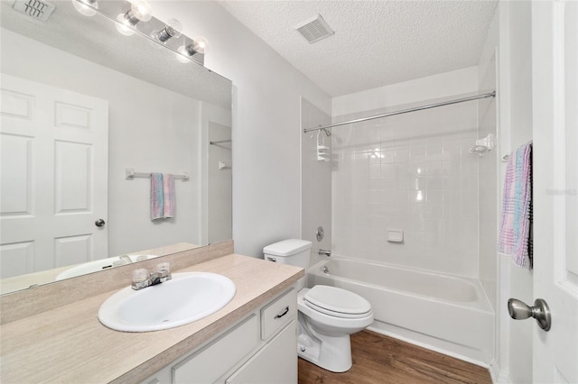 475 NE 155th Pl, Citra, FL 32113 - bathroom featuring vanity, wood finished floors, shower / bath combination, and a textured ceiling