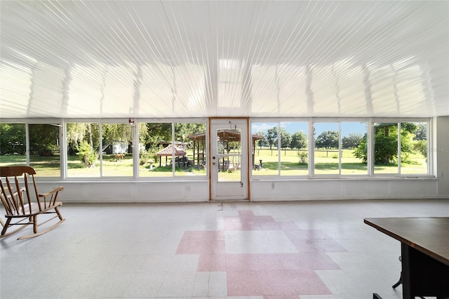 475 NE 155th Pl, Citra, FL 32113 - unfurnished sunroom with plenty of natural light and tile patterned floors