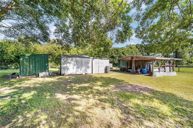 475 NE 155th Pl, Citra, FL 32113 - view of green lawn featuring a storage unit