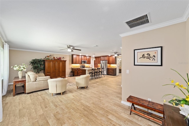 19130 NW 60th Ave, Reddick, FL 32686 - living room with ceiling fan, light wood-type flooring, and ornamental molding