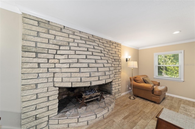 19130 NW 60th Ave, Reddick, FL 32686 - living area with a brick fireplace, wood finished floors, and ornamental molding