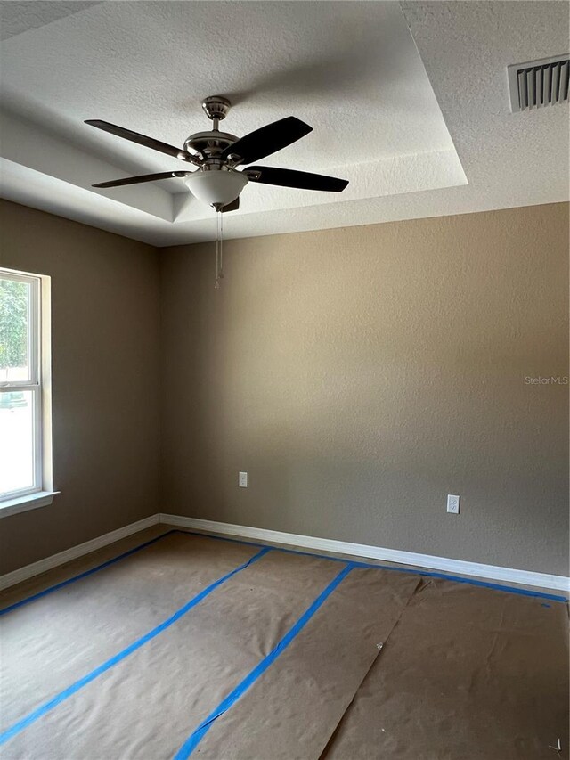 19622 SW Marine Blvd, Dunnellon, FL 34431 - unfurnished room with a textured ceiling and ceiling fan