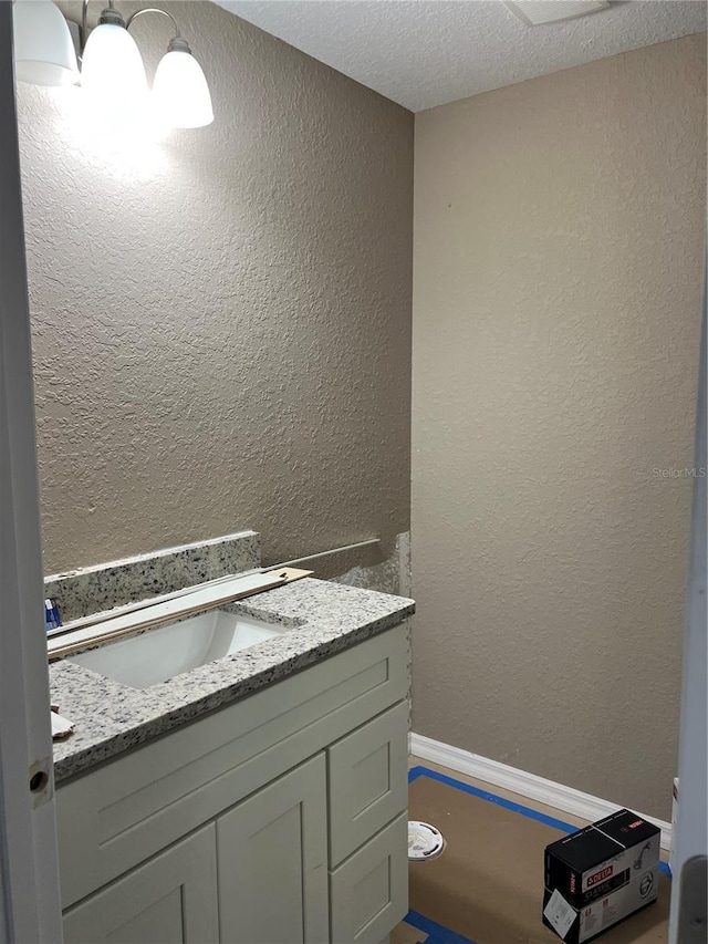 20769 SW Oriole Dr, Dunnellon, FL 34431 - bathroom featuring vanity, a textured wall, and a textured ceiling