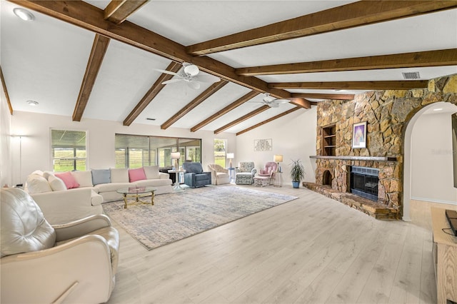 12131 NE 10th Ter, Ocala, FL 34479 - living area featuring plenty of natural light, arched walkways, a ceiling fan, and wood finished floors