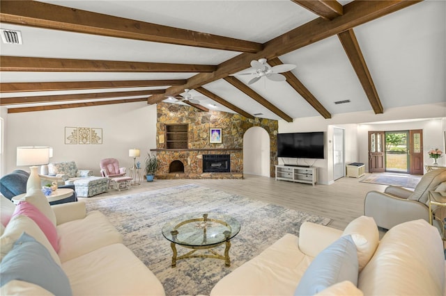 12131 NE 10th Ter, Ocala, FL 34479 - living room with a ceiling fan, wood finished floors, and a stone fireplace