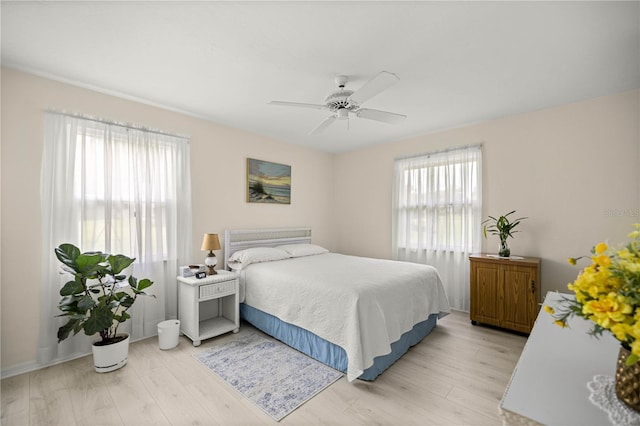 12131 NE 10th Ter, Ocala, FL 34479 - bedroom with light wood-type flooring and a ceiling fan