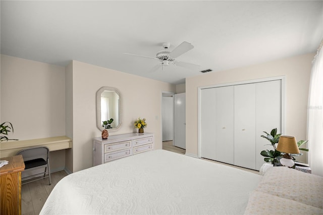12131 NE 10th Ter, Ocala, FL 34479 - bedroom with light wood finished floors, a closet, and ceiling fan