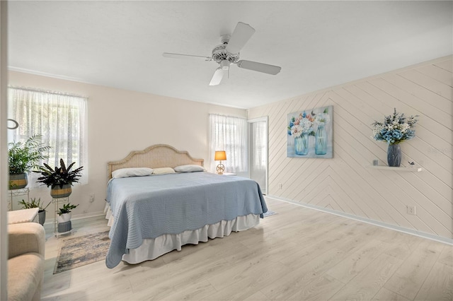 12131 NE 10th Ter, Ocala, FL 34479 - bedroom with light wood finished floors and ceiling fan