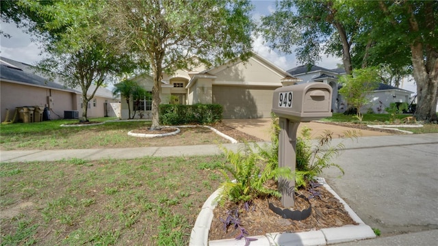 949 Woodsong Way, Clermont, FL 34714 - ranch-style home with concrete driveway and a garage
