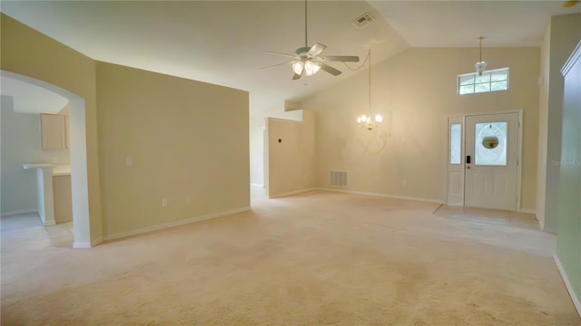 949 Woodsong Way, Clermont, FL 34714 - unfurnished living room with a ceiling fan, arched walkways, high vaulted ceiling, and light carpet