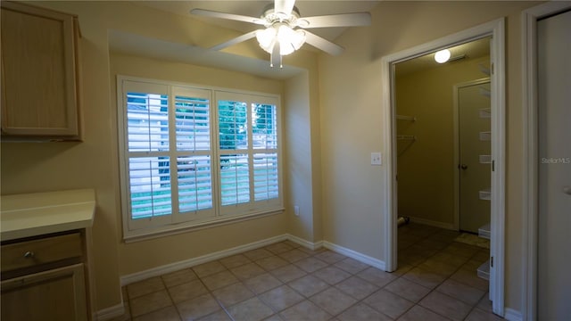 949 Woodsong Way, Clermont, FL 34714 - unfurnished dining area featuring a ceiling fan, light tile patterned flooring, and healthy amount of natural light