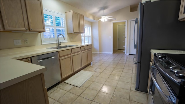 949 Woodsong Way, Clermont, FL 34714 - kitchen with appliances with stainless steel finishes, lofted ceiling, ceiling fan, light tile patterned flooring, and light countertops
