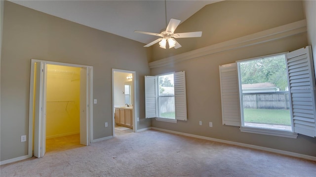 949 Woodsong Way, Clermont, FL 34714 - unfurnished bedroom featuring lofted ceiling, carpet flooring, ensuite bathroom, and ceiling fan