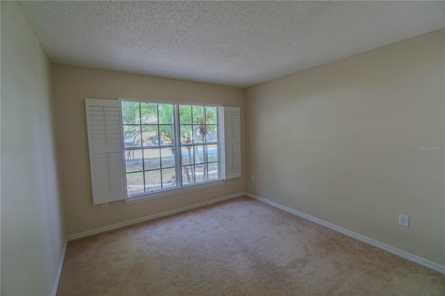 949 Woodsong Way, Clermont, FL 34714 - spare room featuring carpet floors and a textured ceiling