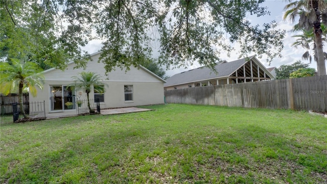 949 Woodsong Way, Clermont, FL 34714 - fenced backyard with a patio area