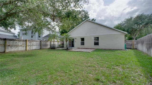 949 Woodsong Way, Clermont, FL 34714 - rear view of property with a patio area, a fenced backyard, and stucco siding
