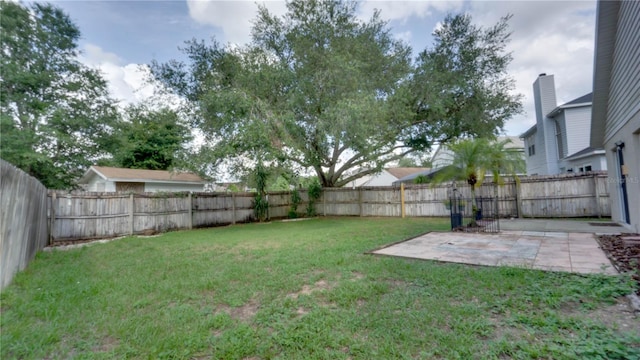 949 Woodsong Way, Clermont, FL 34714 - fenced backyard featuring a patio