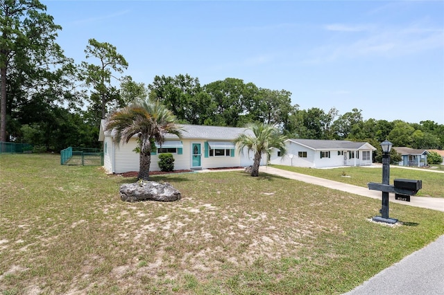 8247 SW 105th Pl, Ocala, FL 34481 - ranch-style house with driveway and view of wooded area