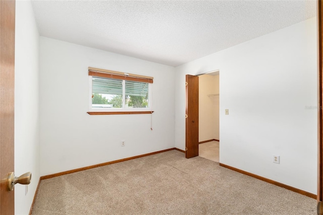 8247 SW 105th Pl, Ocala, FL 34481 - empty room featuring light colored carpet and a textured ceiling