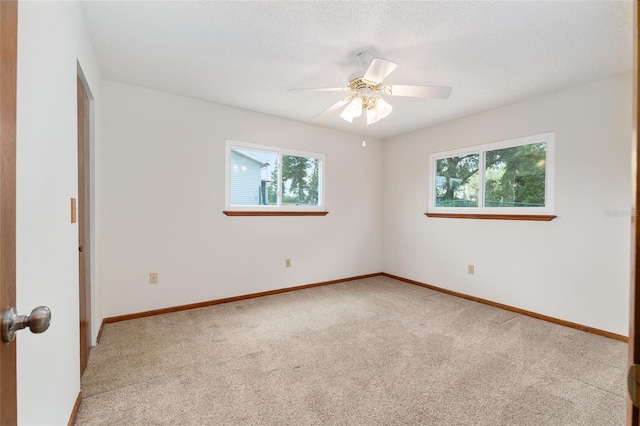 8247 SW 105th Pl, Ocala, FL 34481 - unfurnished room featuring healthy amount of natural light, light carpet, ceiling fan, and a textured ceiling