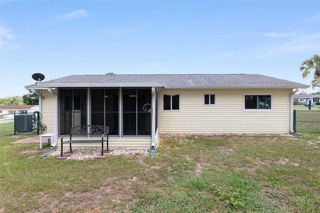 8247 SW 105th Pl, Ocala, FL 34481 - rear view of property featuring a sunroom and a shingled roof