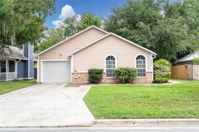 2864 SW 40th Ave, Gainesville, FL 32608 - view of front of house with brick siding, a garage, and concrete driveway