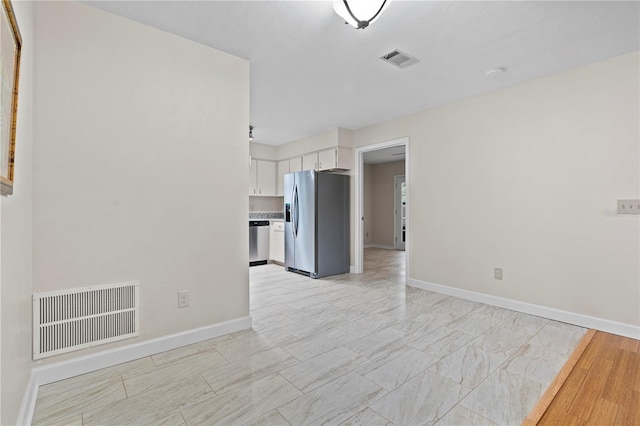 2864 SW 40th Ave, Gainesville, FL 32608 - unfurnished living room with baseboards