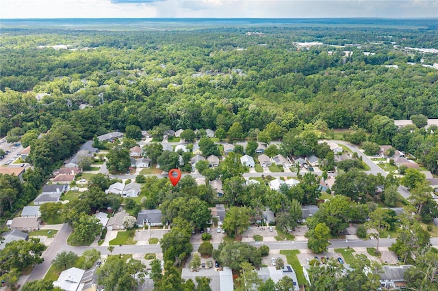 2864 SW 40th Ave, Gainesville, FL 32608 - aerial view of property and surrounding area with a forest and nearby suburban area