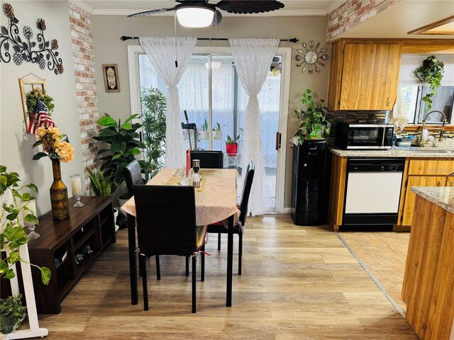 8547 SW 106th Pl, Ocala, FL 34481 - dining room with ornamental molding, light wood-style flooring, and ceiling fan