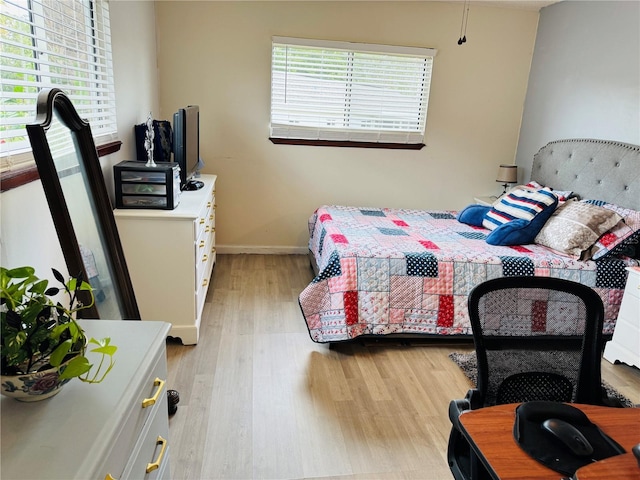 8547 SW 106th Pl, Ocala, FL 34481 - bedroom with light wood finished floors and baseboards