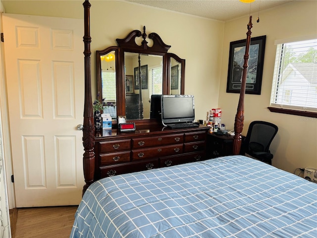8547 SW 106th Pl, Ocala, FL 34481 - bedroom featuring wood finished floors and a textured ceiling