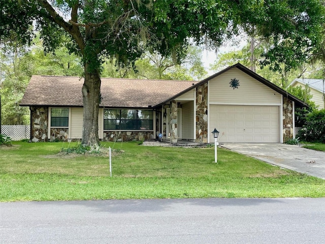 1112 NE 130th Ter, Silver Springs, FL 34488 - view of front facade featuring stone siding, a garage, concrete driveway, and a front lawn