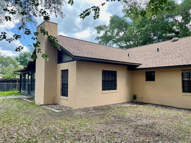 1112 NE 130th Ter, Silver Springs, FL 34488 - view of home's exterior featuring roof with shingles and stucco siding