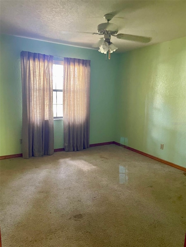 1112 NE 130th Ter, Silver Springs, FL 34488 - unfurnished room featuring a ceiling fan and carpet flooring