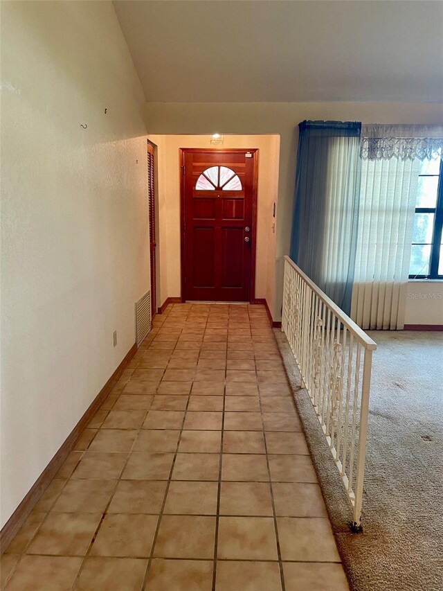 1112 NE 130th Ter, Silver Springs, FL 34488 - corridor featuring light tile patterned flooring and baseboards