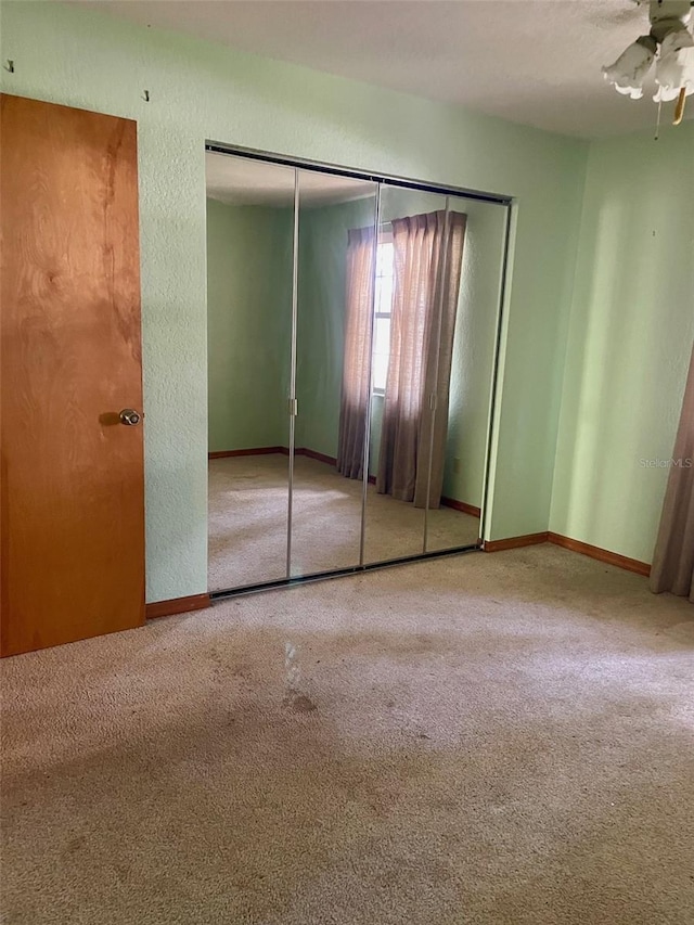 1112 NE 130th Ter, Silver Springs, FL 34488 - unfurnished bedroom featuring carpet and a closet