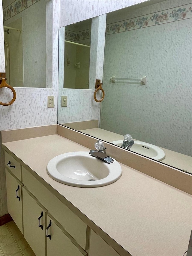 1112 NE 130th Ter, Silver Springs, FL 34488 - full bathroom featuring vanity, wallpapered walls, and tile patterned floors
