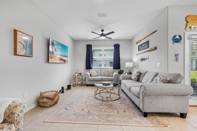 14347 Easy Goer St, Ruskin, FL 33573 - tiled living area featuring healthy amount of natural light and a ceiling fan