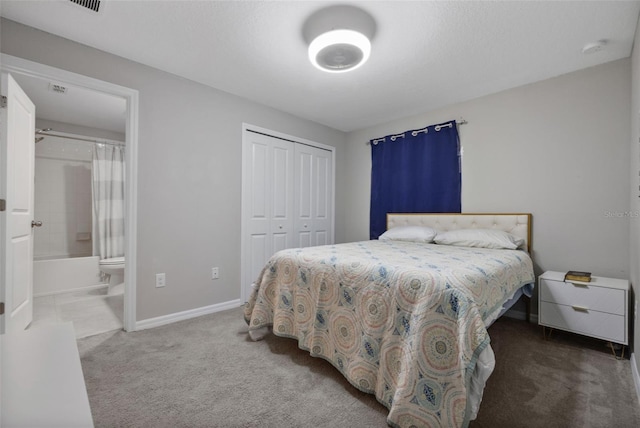 14347 Easy Goer St, Ruskin, FL 33573 - carpeted bedroom featuring a closet and connected bathroom