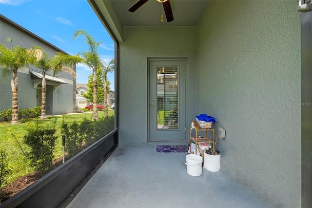 14347 Easy Goer St, Ruskin, FL 33573 - property entrance with a ceiling fan and stucco siding