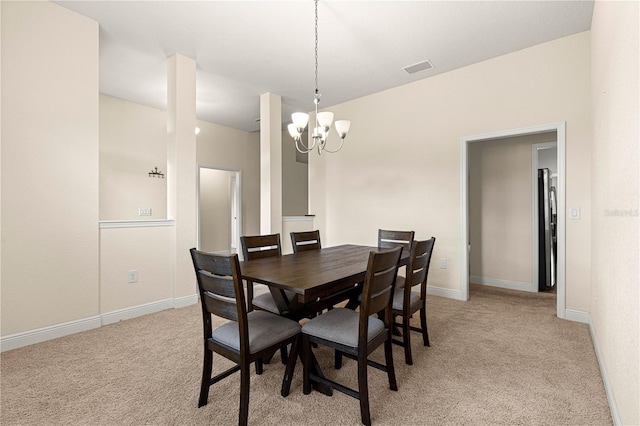 8 Diamond Club Rd, Ocala, FL 34472 - dining space with light carpet and a chandelier