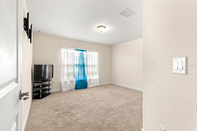 8 Diamond Club Rd, Ocala, FL 34472 - unfurnished living room featuring carpet, a textured wall, and a textured ceiling