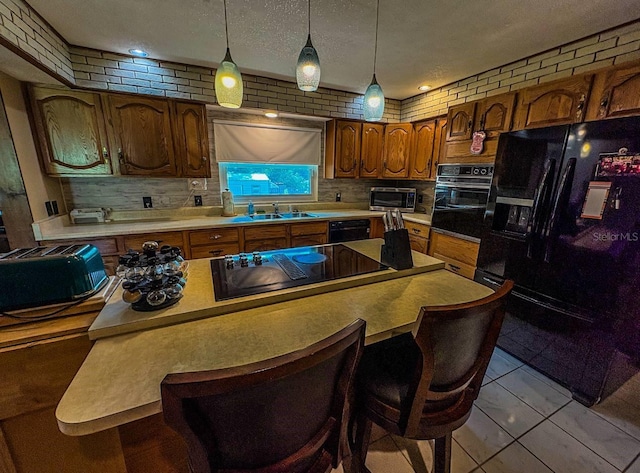 3545 SE 24th Ave, Ocala, FL 34471 - kitchen with black appliances, backsplash, a center island, and light countertops