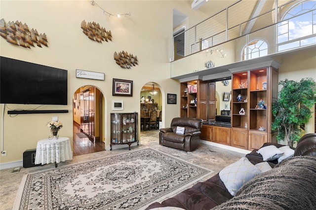200 Asphodel Dr, Dothan, AL 36303 - living room with arched walkways, a towering ceiling, and light marble finish flooring
