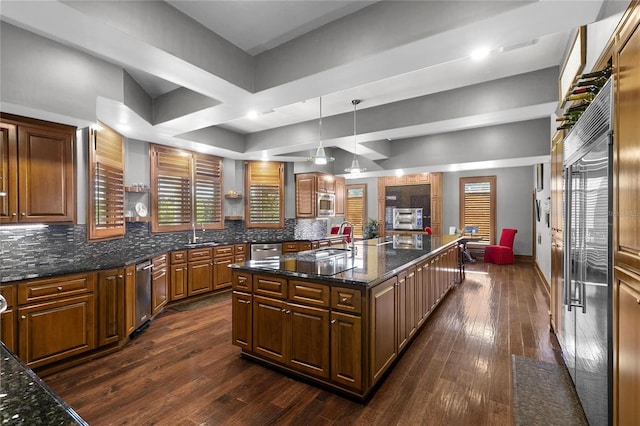 200 Asphodel Dr, Dothan, AL 36303 - kitchen with dark wood-style floors, tasteful backsplash, a kitchen island with sink, and built in appliances