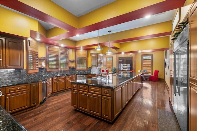 200 Asphodel Dr, Dothan, AL 36303 - kitchen with dark wood-style floors, tasteful backsplash, dark stone counters, and a spacious island
