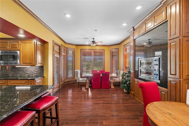 200 Asphodel Dr, Dothan, AL 36303 - dining area featuring ceiling fan, ornamental molding, dark wood-type flooring, and recessed lighting
