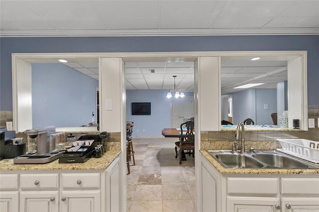 200 Asphodel Dr, Dothan, AL 36303 - kitchen with a paneled ceiling, a chandelier, and white cabinetry
